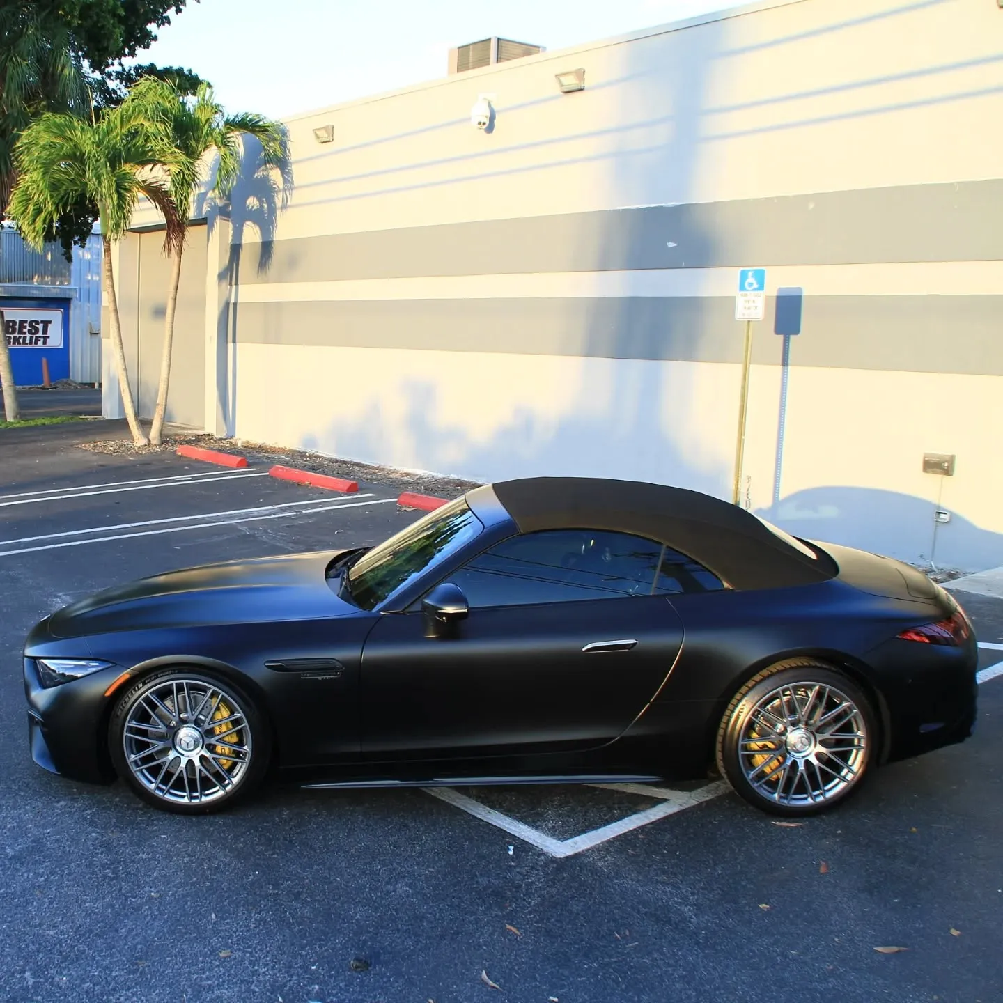 Matte black Mercedes-AMG convertible parked outside Advanced Detailing Sofla