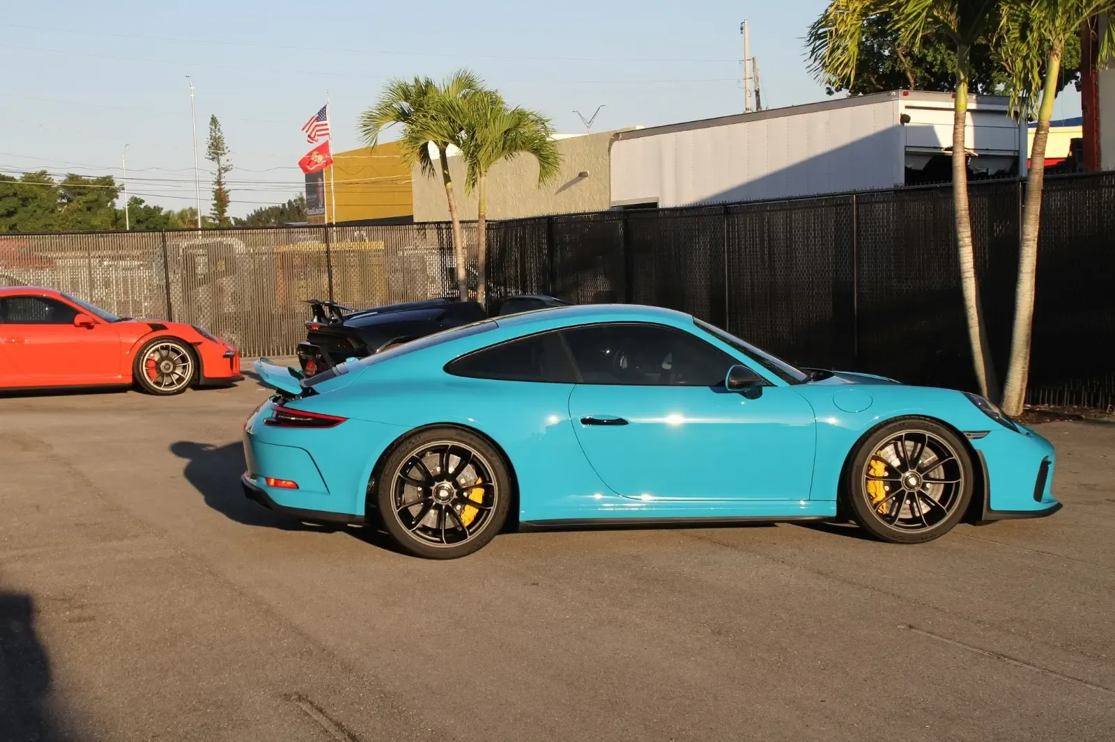 Miami blue Porsche GT Touring after window tinting at Advanced Detailing Sofla