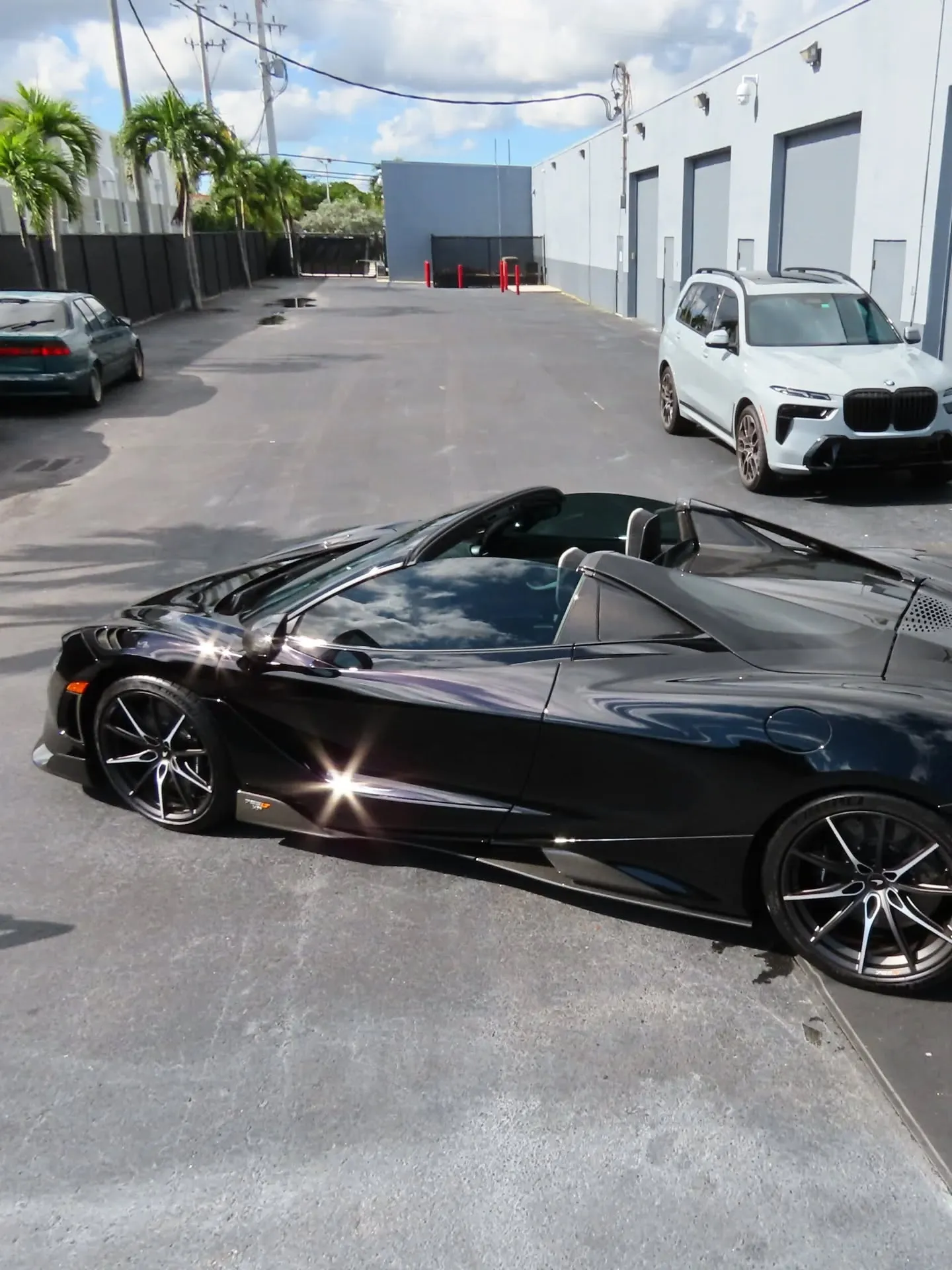 Black McLaren 720S Spider outside the Advanced Detailing Sofla studio