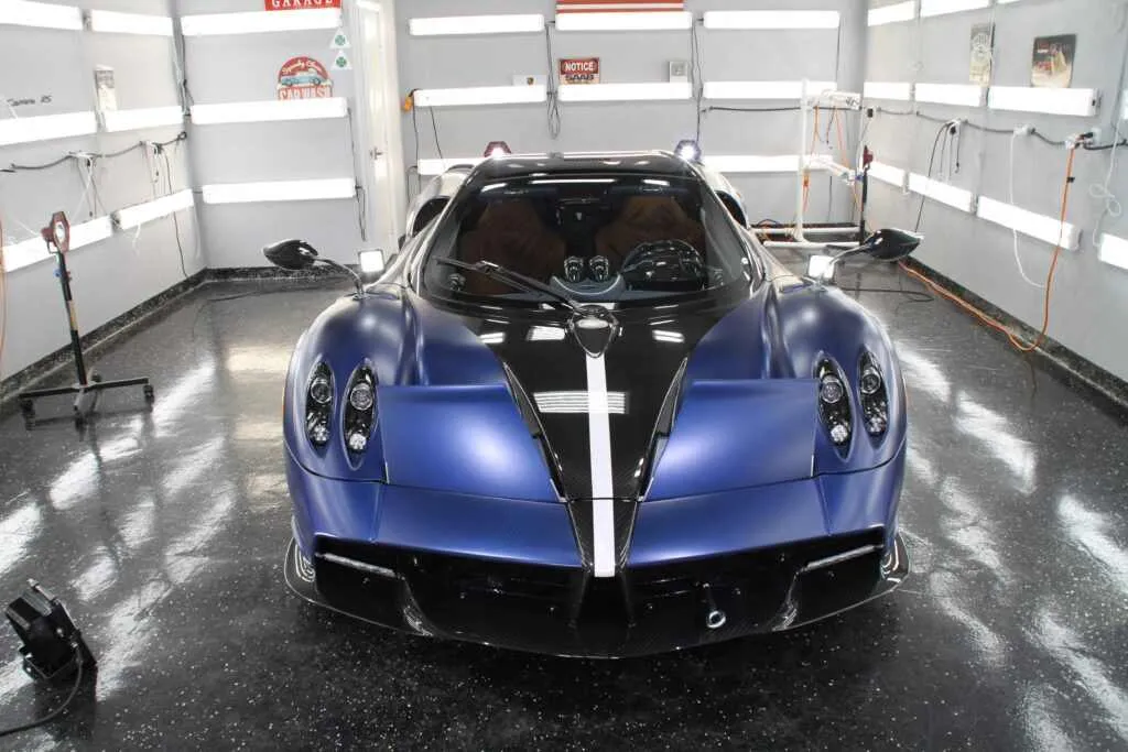 Blue and black Pagani Huayra in the Advanced Detailing Sofla work bay