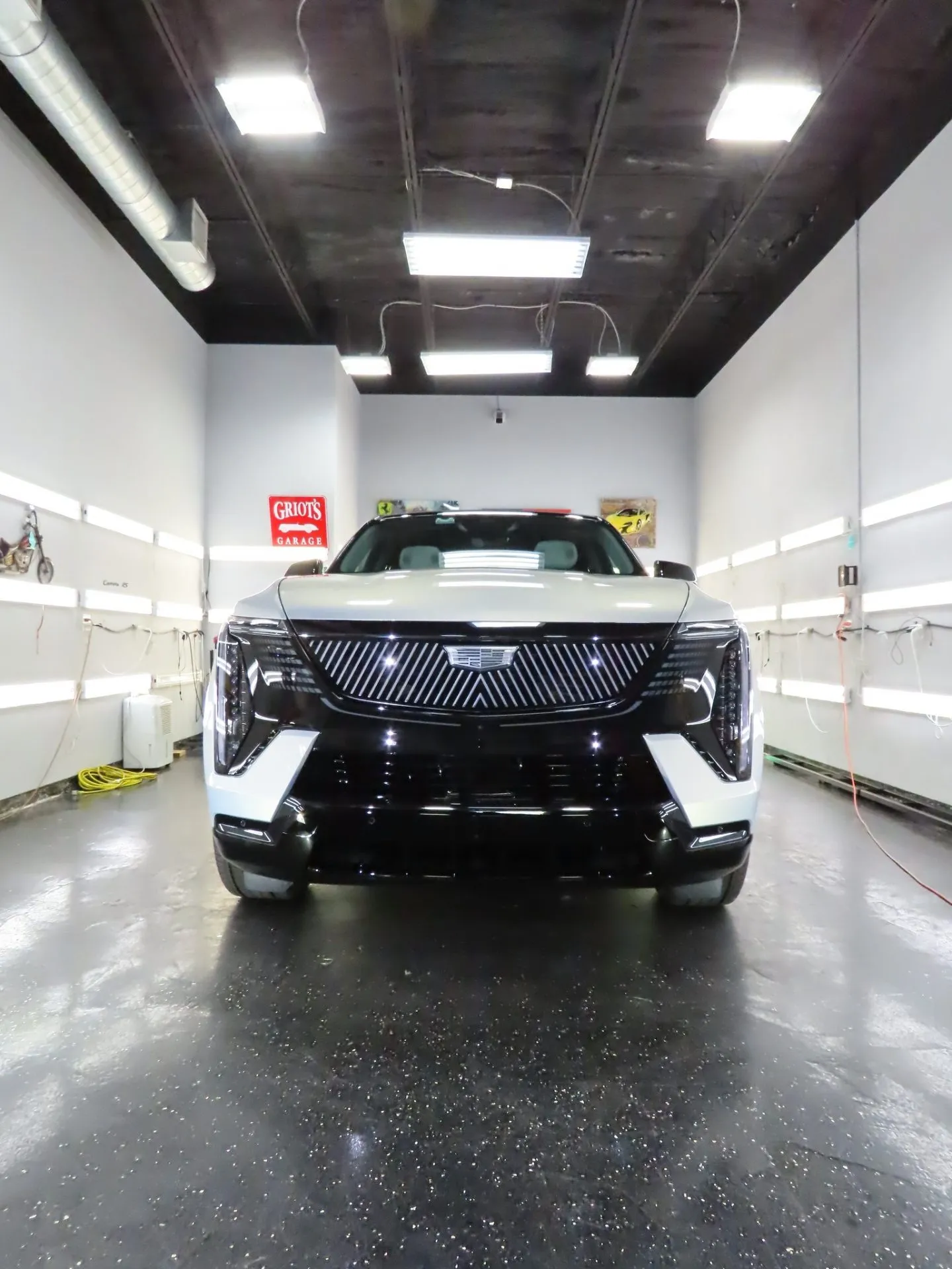 White Cadillac Escalade IQ in the Advanced Detailing Sofla work bay