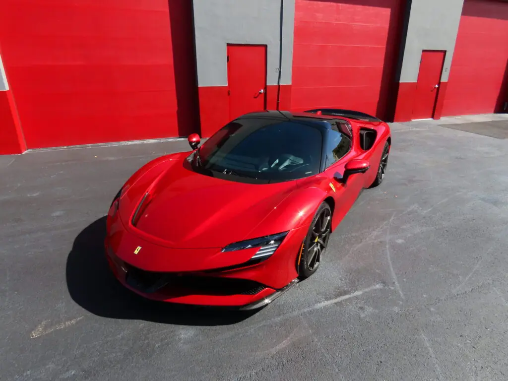 Red Ferrari SF90 at the Advanced Detailing Sofla studio in Pompano Beach