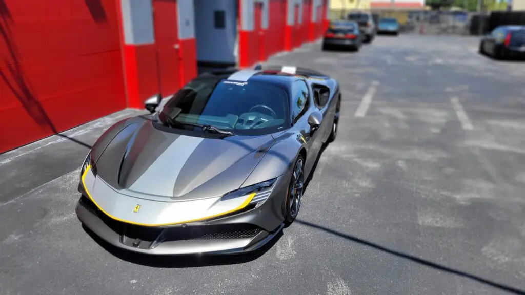 Silver Ferrari SF90 at the Advanced Detailing Sofla studio in Pompano Beach