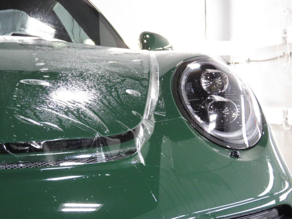 green car hood and light paint protection film Advanced Detailing Sofla Pompano Beach FL